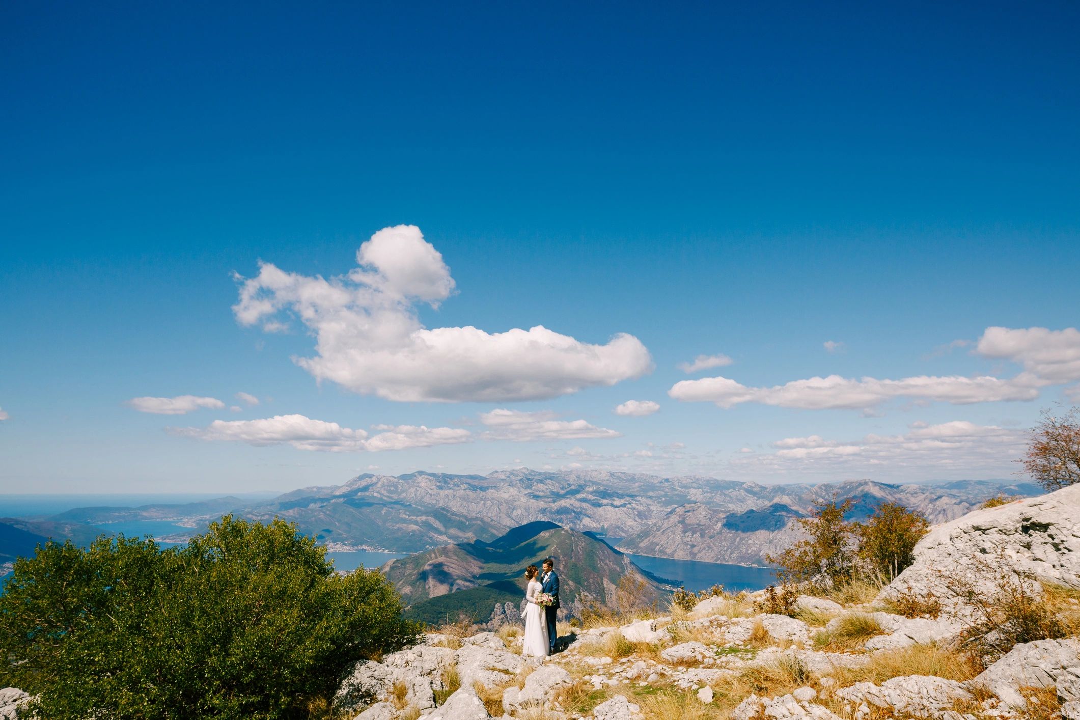 Wedding couple overlooking a panoramic bay view